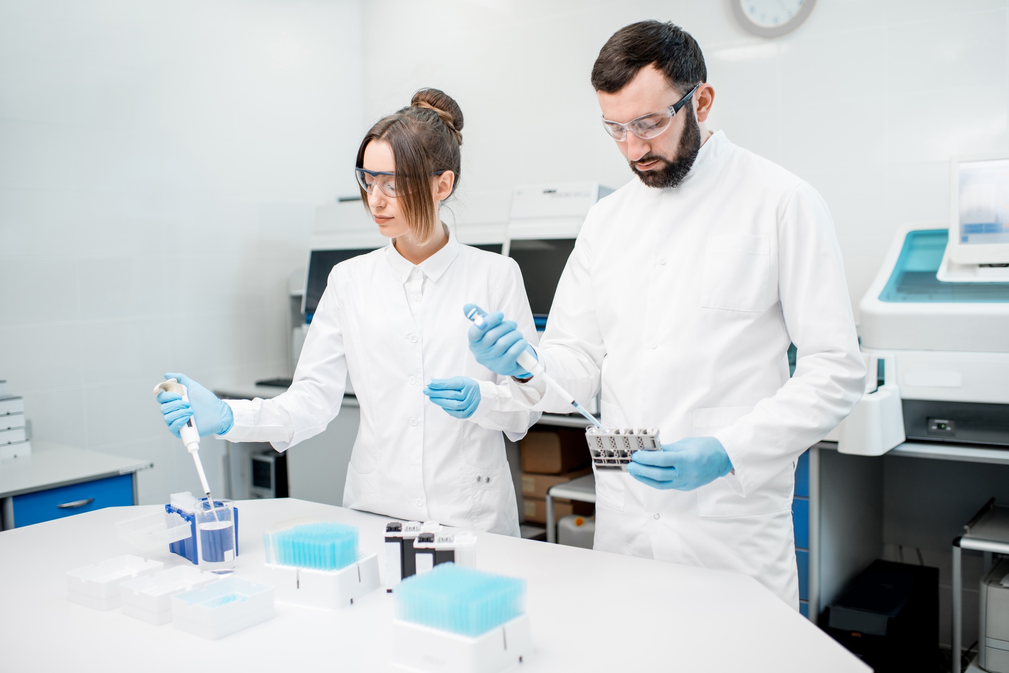 Laboratory assistants working with test tubes