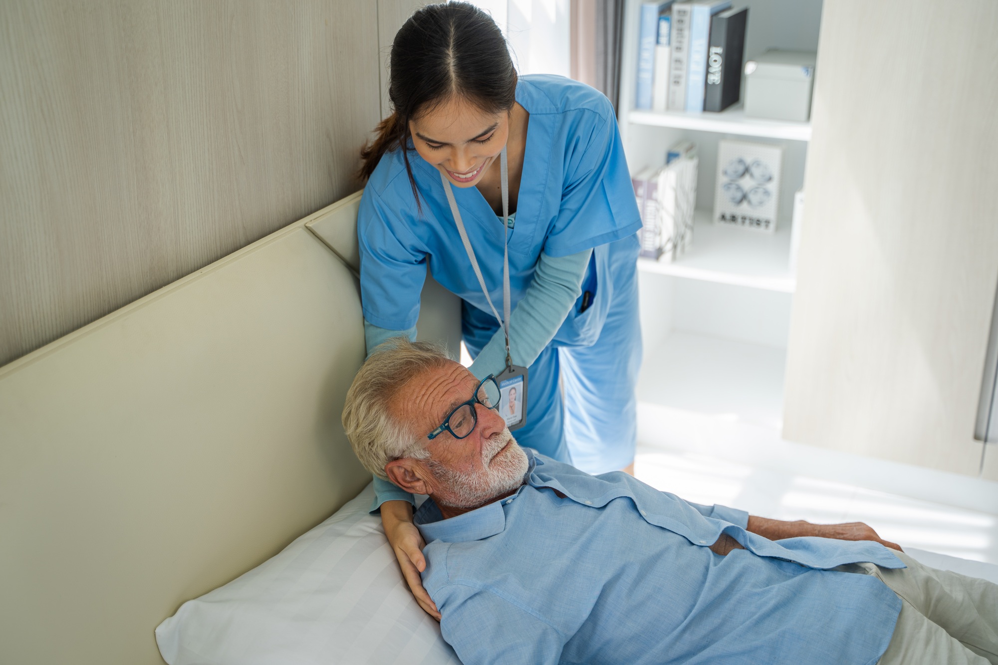 Nurse take care elderly man,Nurse talk support male senior patient,Elderly healthcare concept.