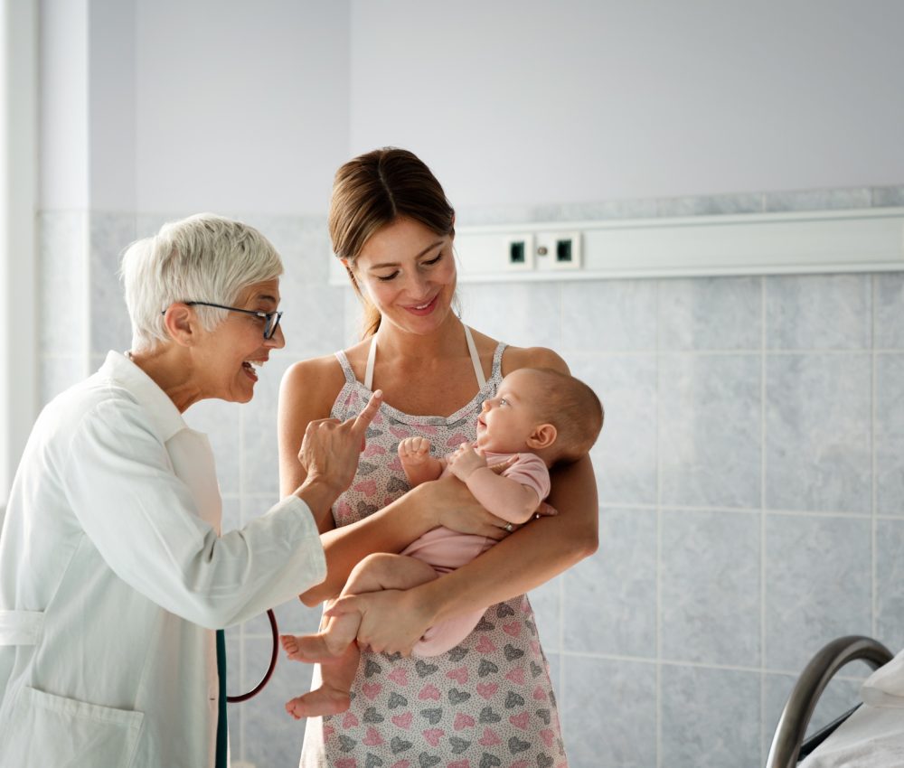 Pediatric doctor exams little baby. Health care, medical examination, people concept